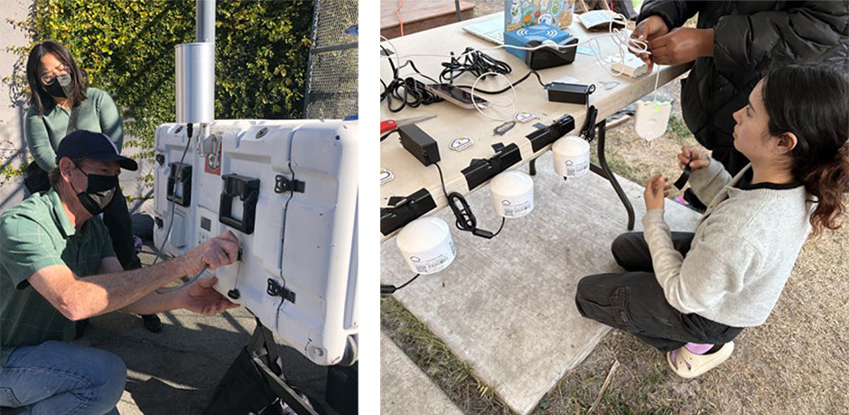 Team members and volunteers setting up air monitoring equipment during an outdoor community training.