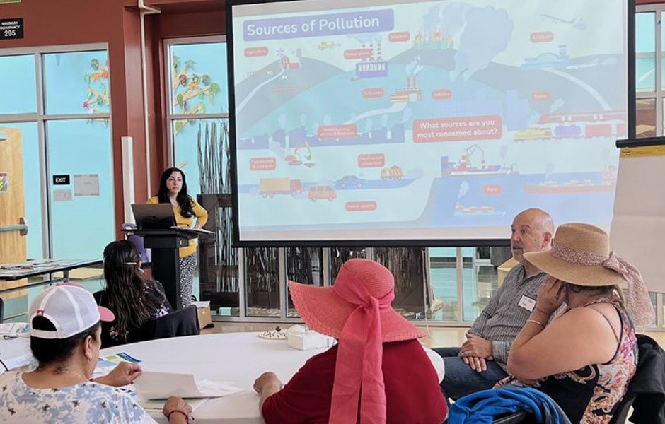 Group of people meeting and viewing a presentation about Data Access and Analysis.