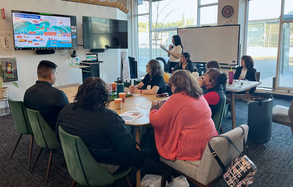 Community members viewing a presentation while attending a workshop on Air Quality.
