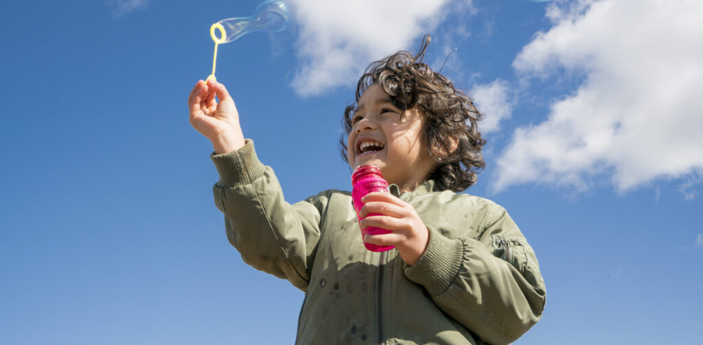 Boy blowing bubbles