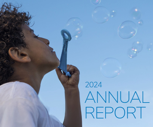 Annual Report Cover 2024 Boy blowing bubbles
